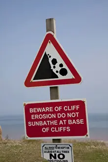 Riding Prints: Warning sign coastal erosion on cliffs East Newton East Riding of Yorkshire UK