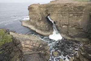 Arches Prints: Water flowing through Sea Arch - Yesnaby Cliffs - Mainland Orkney LA005169