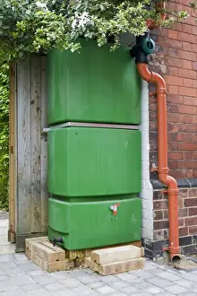 Storage Prints: Water Tank - Large green rectangular plastic water storage tank collecting rainwater from roof Cheltenham UK
