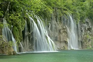 Calc Sinter Prints: Waterfall cascades and emerald pool in forest at the upper lakes area Plitvice Lakes National Park