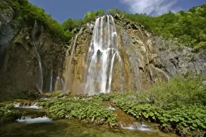 Mediterranean Prints: Waterfall cascading down steep cliffs in lower canyon area Plitvice Lakes National Park