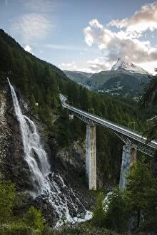 Waterfall with rail viaduct bridge Matterhorn Mountain