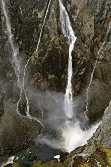 waterfalls view into deep gorge towards the thundering water masses of Voringfossen in early spring Voringfossen, Hardangervidda, Fjord-Norway, Norway