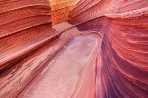 The Wave - carved rock eroded into a wave-like formation made of jurrasic-age Navajo Sandstone that is approximately