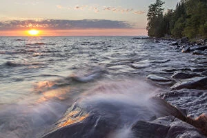 Waves crash at sunset on Devils Island in