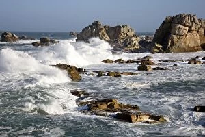 Waves crashing against rocky coastline
