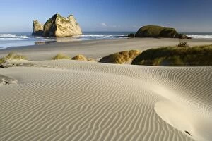 Wharariki Beach - white sand dunes of Whaririki Beach