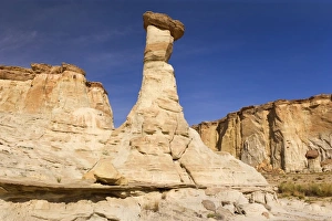 White Hoodoo - beautiful white hoodoo topped by a brown rock White Hoodoo - beautiful white hoodoo topped by a brown rock