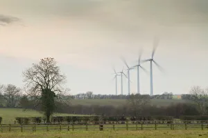 Wind Turbine - A row of wind turbines producing green energy Wind Turbine - A row of wind turbines producing green energy