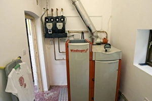 Images Dated 31st August 2007: Windhager Austrian wood pellet fired domestic biomass boiler produces heat for thermal store using
