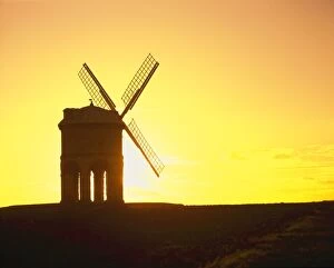 Windmill - built on stone arches - silhouette at sunset