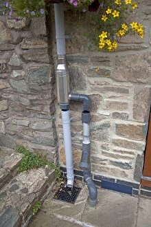 Images Dated 23rd September 2010: Wisey stainless steel rain water diverter and filter installed in downpipe of eco house UK
