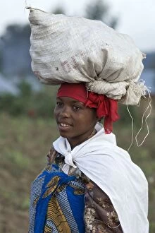 Images Dated 12th August 2008: Woman - carrying potatoes to the market