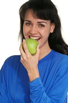 Apples Gallery: Woman - eating green Apple