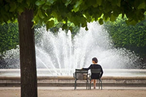 Images Dated 17th September 2013: Woman relaxing at the fountain in the Garden
