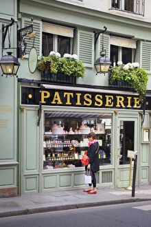 Images Dated 17th September 2013: Woman window shopping at Lauderee Patisserie