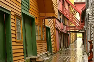 wooden houses alley and colourful historic trade houses in UNESCO world heritage site of Bryggen Bergen, Norway
