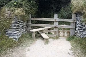 Images Dated 10th August 2006: Wooden stile with dog gate between stone walls on cliff path North Devon UK