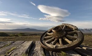 Wooden Wheel with Lenticular Clouds in the background