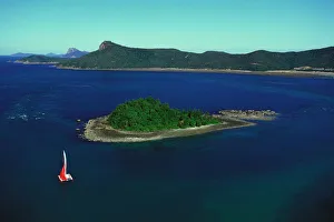Seascape Collection: Yacht sailing past Plum Pudding Island, Whitsunday Group Whitsunday Group