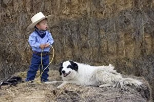 Images Dated 2nd September 2005: Young boy playing at being a cowboy with Border Collie dog