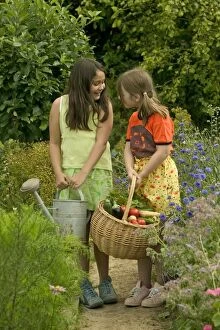 Young girls - in vegetable garden, gardening